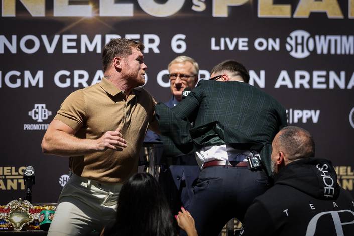 Plant gets a cut during his press conference scuffle with Alvarez