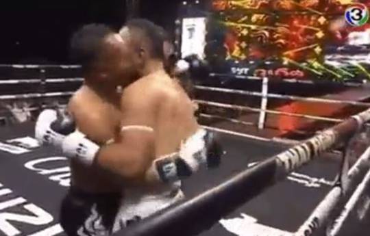 Fighter kisses his opponent during the fight