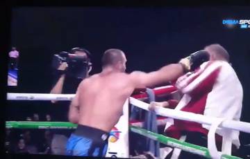 Boxer punches his corner man after defeat (video)