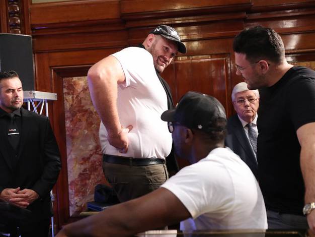 Tyson Fury shows off his fat to Chisora