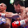 Pacquiao decisions Thurman, knocks him down