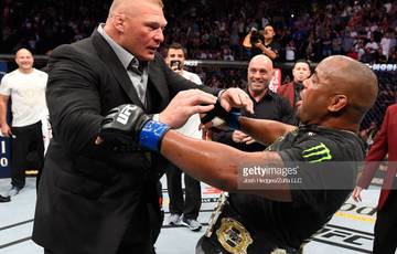 Cormier and Lesnar scuffle in the octagon