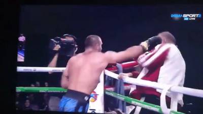 Boxer punches his corner man after defeat (video)