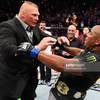 Cormier and Lesnar scuffle in the octagon