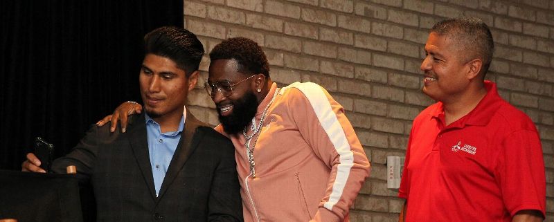 Adrien Broner, center, and Mikey Garcia pose for a selfie before their news conference in New York to announce their junior welterweight bout in July