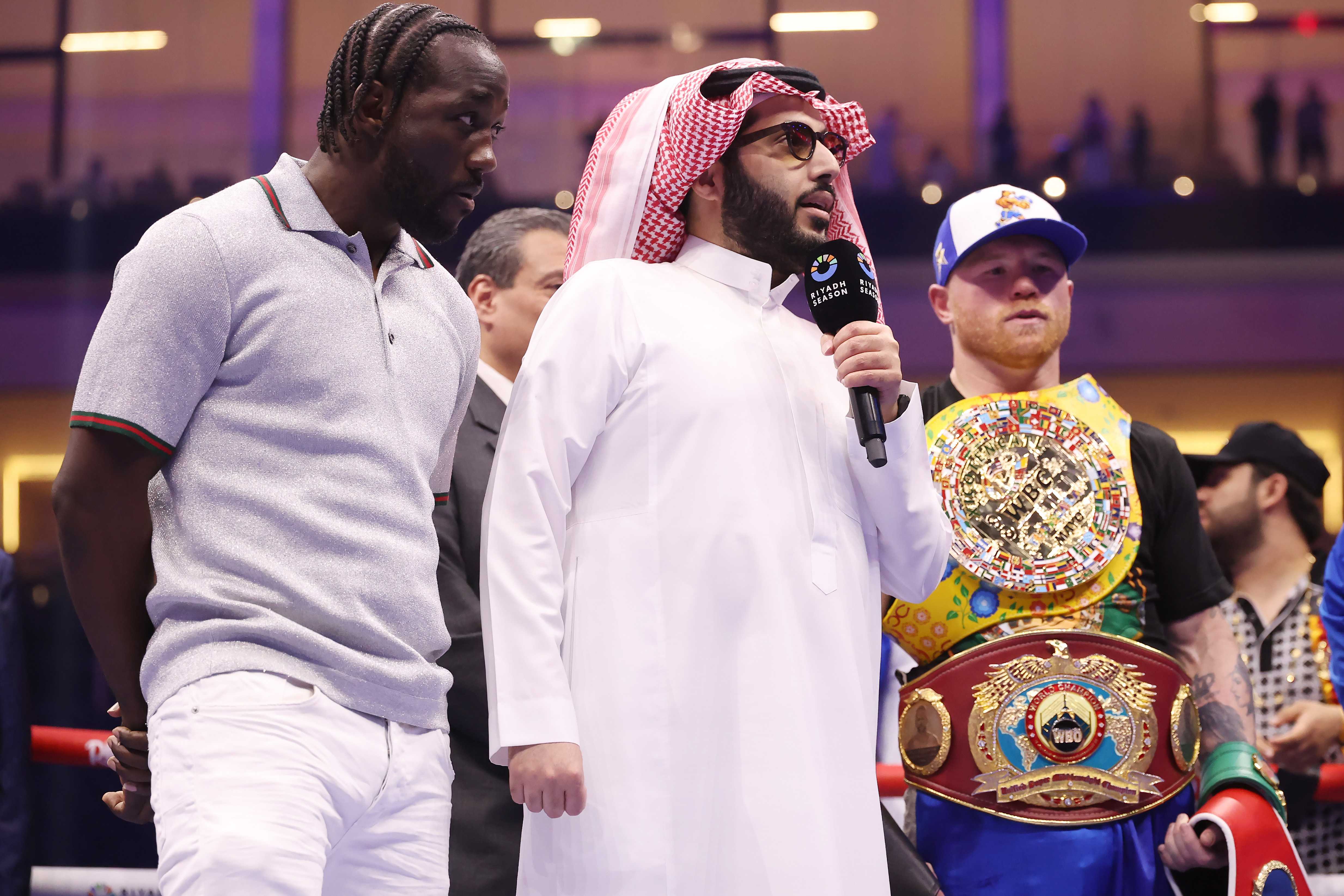 Terence Crawford, Turki Al al-Sheikh, and Saul Alvarez. Getty Images